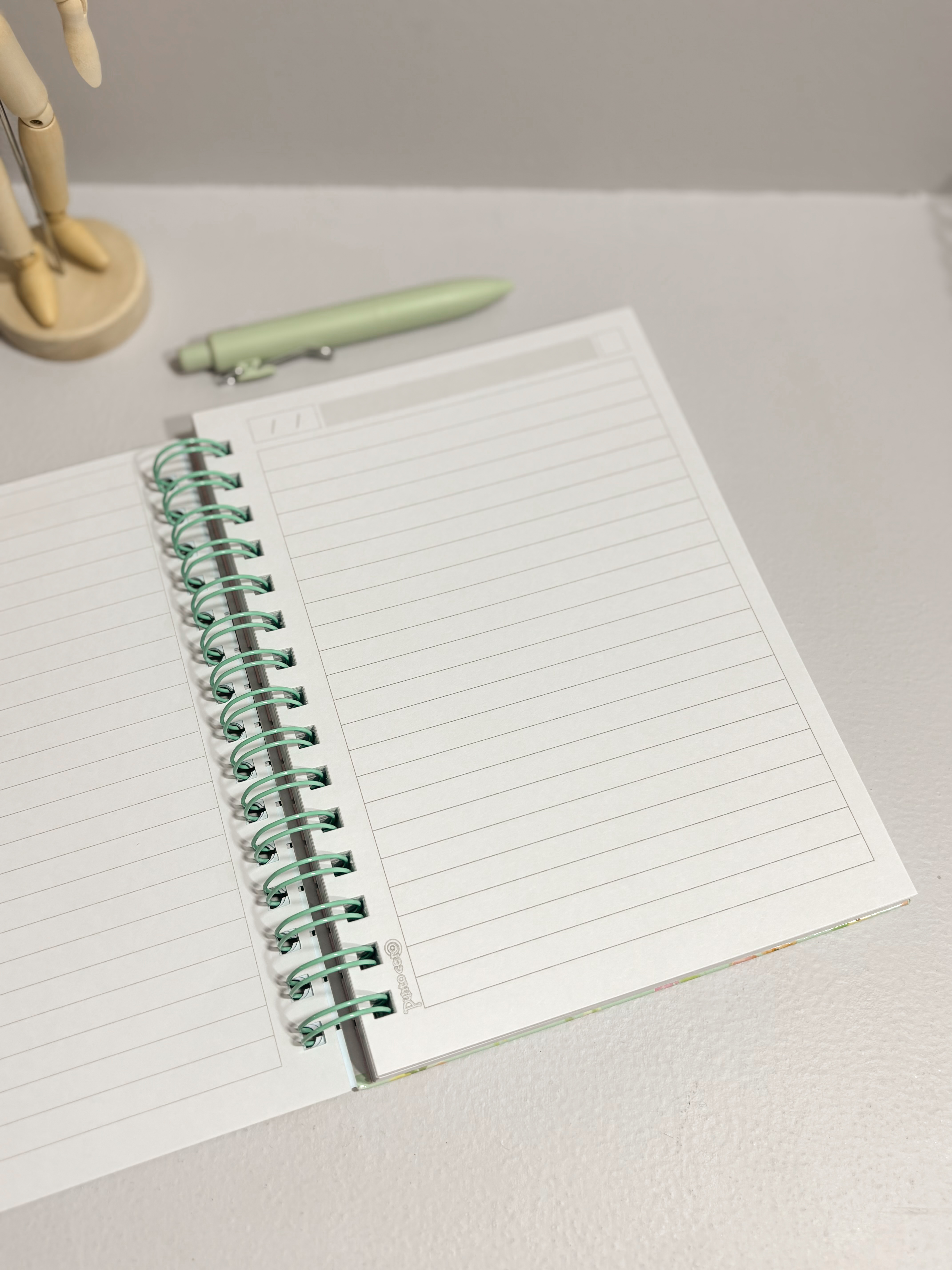 Cuaderno Be Positive A5 espiral Flowers verde agua 100 hojas rayadas